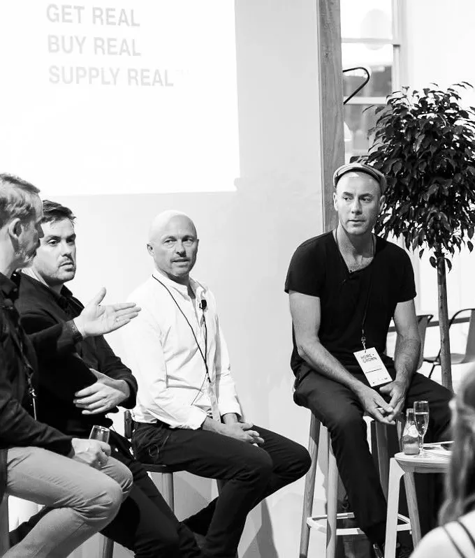 Four men on a panel, discussing design