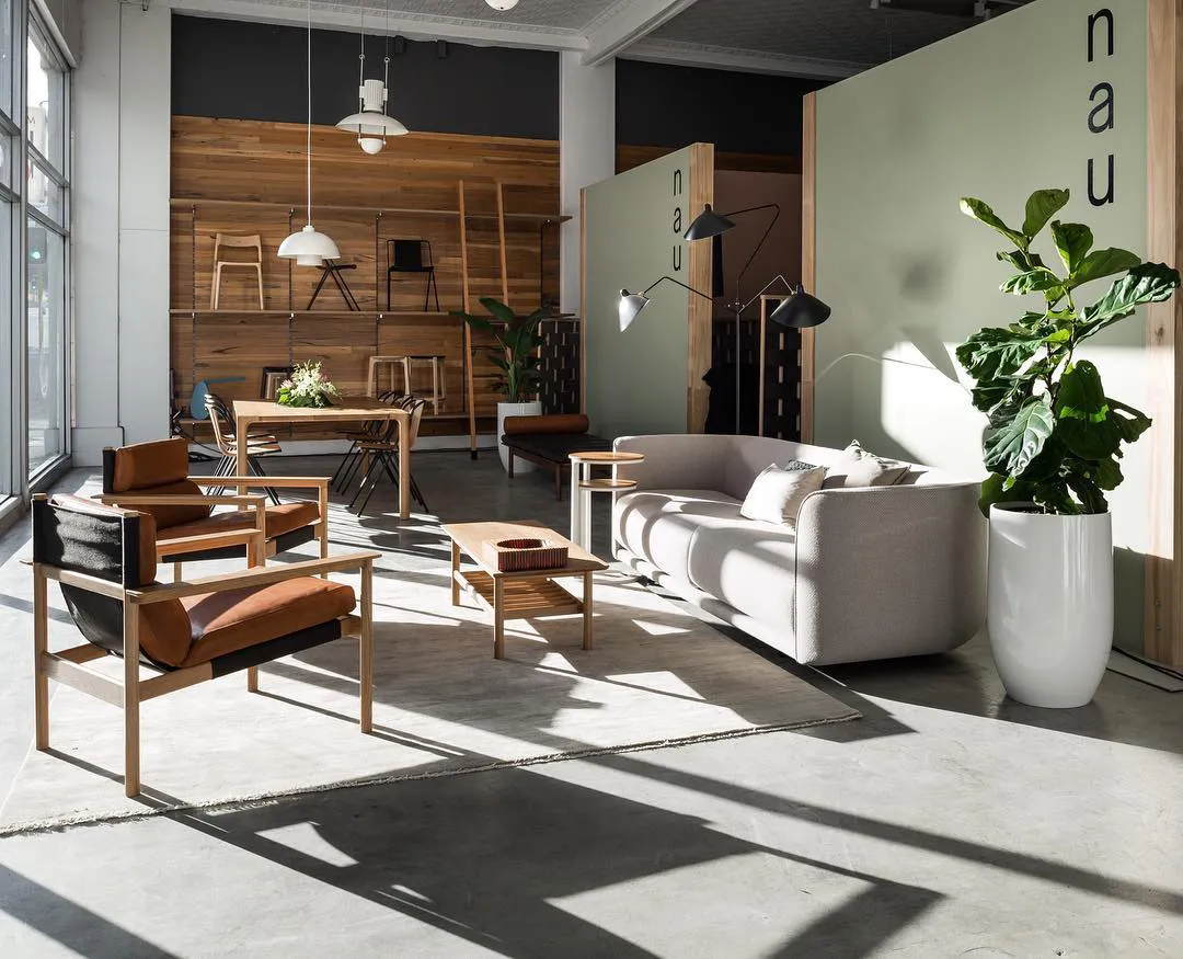 Photo of the designfarm showroom with various furniture pieces and sunlight coming through the window