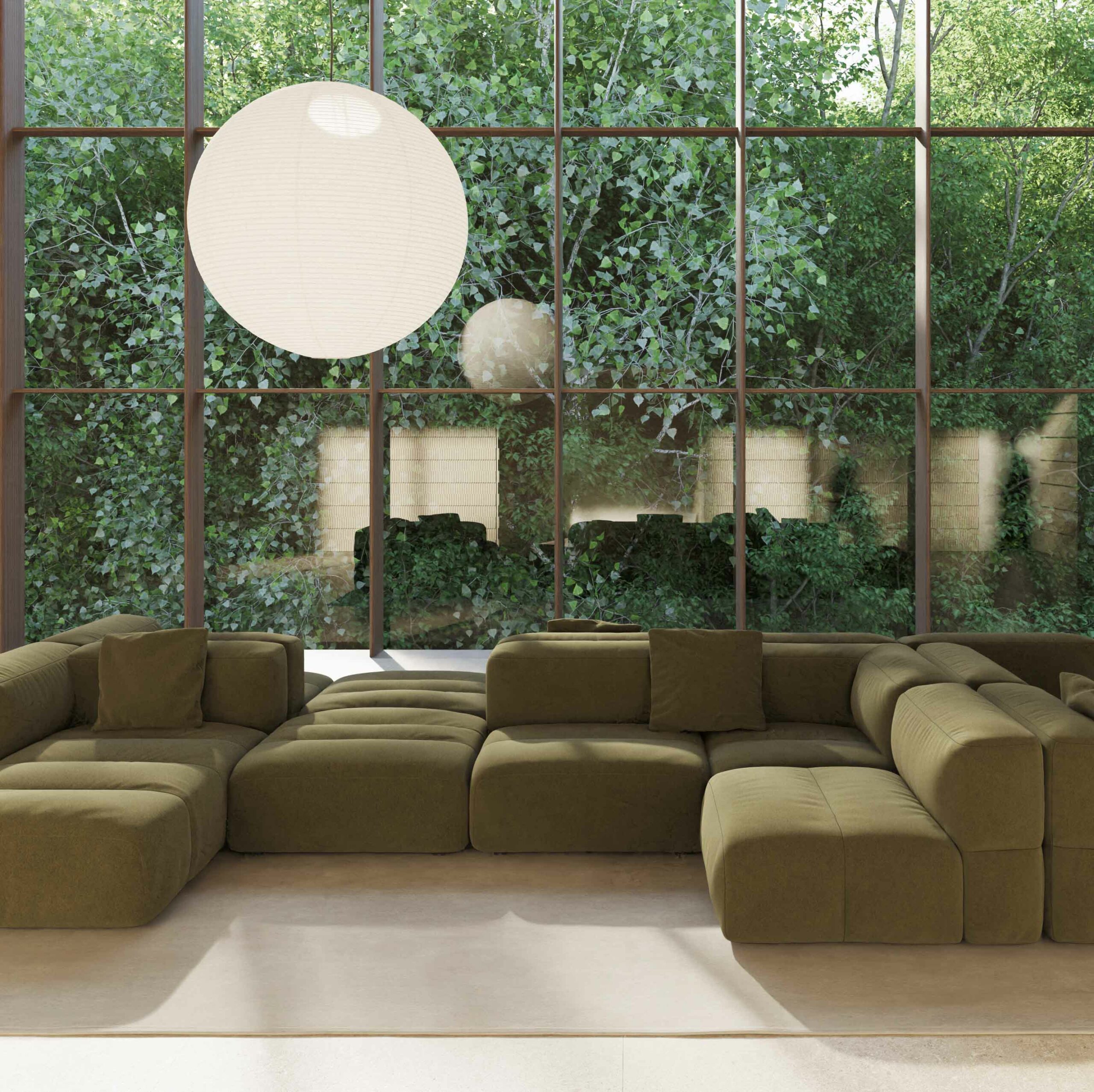 The Viccarbe Savina Sofa in green in a architectural setting with a pendant hanging over and a floor to ceiling window overlooking a vine garden
