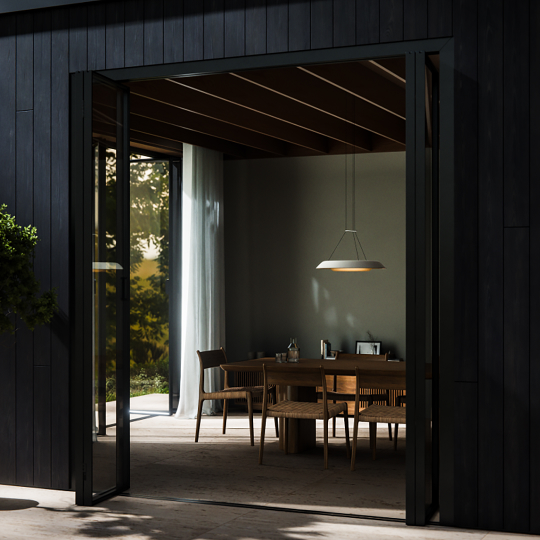 Overhead view of Plusminus pendant lighting by Vibia hanging above a seated lounge area with modern furniture